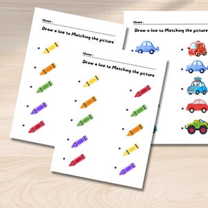 May include: A printable worksheet with a matching game for kids. The worksheet has a column of crayons in different colors and a column of pictures of cars. The child is instructed to draw a line from each crayon to the car that matches its color.