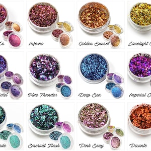 May include: Twelve small jars of iridescent glitter, each with a different color and name. The colors include gold, red, purple, blue, green, and pink. The names include Shangri La, Inferno, Golden Sunset, Limelight Gold, Royal Violet, Blue Thunder, Deep Sea, Imperial Orchid, Aqua Verde, Emerald Flash, Pink Envy, and Picante.