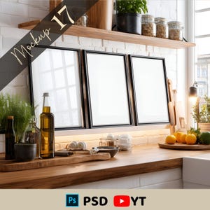 May include: A kitchen scene featuring three black framed blank art prints leaning against a white brick wall. A wooden countertop displays various kitchen items, including bottles, jars, and produce. The text "Mockup 17" is diagonally across the image.