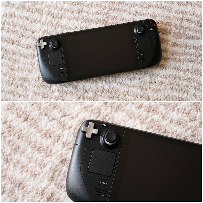 May include: A black handheld gaming console with a large screen and integrated controls. The console features a directional pad, analog sticks, buttons, and a touch screen. The Steam logo is visible on the device.