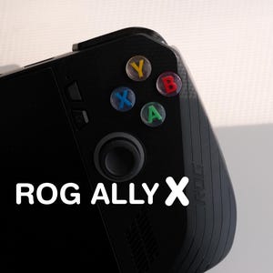 May include: A black handheld gaming console featuring coloured Y, B, X, and A buttons. It has a joystick and the white text "ROG ALLY X".
