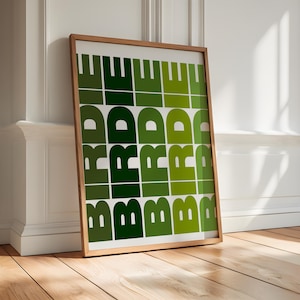 May include: A framed print with a green and white geometric pattern featuring the word "BRIDE" repeated multiple times.