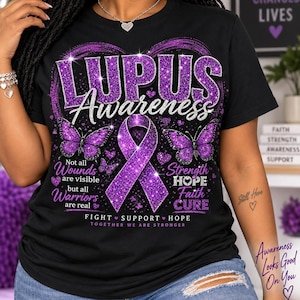 May include: A black t-shirt featuring a purple glitter graphic with the text LUPUS Awareness, Not all Wounds are visible but all Warriors are real, Strength HOPE Faith CURE, and FIGHT SUPPORT HOPE TOGETHER WE ARE STRONGER with butterflies.