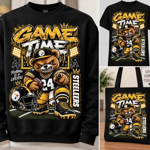 May include: A black sweatshirt, t-shirt, and tote bag featuring a graphic of an aggressive bear wearing a football uniform with the number 24, a helmet, and the text GAME TIME, STEELERS, and FOOTBALL IS A LIFESTYLE in yellow and white.