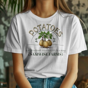 May include: White t-shirt with a graphic of potatoes and the text "POTATOES Boil 'em - Mash 'em - Stick 'em in a stew SAMWISE FARMS"