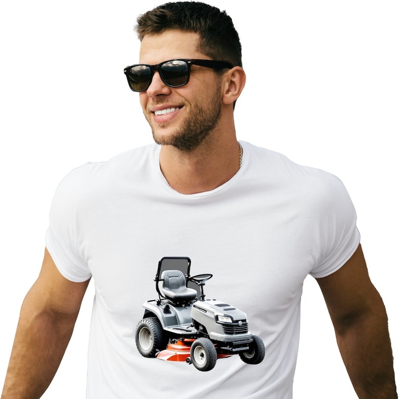 May include: A white t-shirt with a gray and orange lawnmower printed on the front.