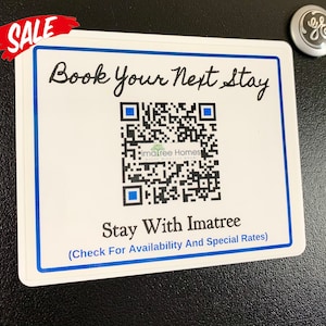 May include: White sticker with blue border, featuring a QR code and the text "Book Your Next Stay" in black cursive font. Below the QR code is the text "Stay With Imatree (Check For Availability And Special Rates)" in blue text.
