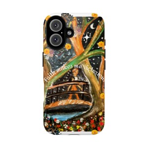 May include: A phone case with an artistic design. It features a tree, a cable car, and a night sky with stars. The case has the text "Faith makes me victorious" and is decorated with yellow flowers.