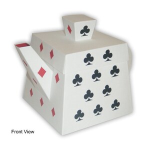 May include: White teapot-shaped box with a red diamond pattern and black clover symbols. The box is open and the lid is on top. The text "Front View" is below the box.