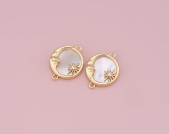 May include: Two gold-tone crescent moon charms with a white mother-of-pearl inlay and a clear rhinestone star in the center.