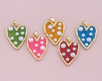 May include: Five gold heart-shaped pendants with different colored enamel and white pearl accents. The pendants are green, orange, pink, red, and blue.