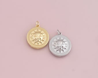 May include: Two sun pendant charms, one gold and one silver, with a detailed face and sunburst design.