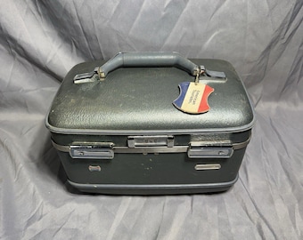 Neceser vintage American Tourister color aguamarina rígido con cierre de combinación