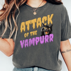 Shirt with the text 'Attack of the Vampurr' and an illustration of a black cat with fangs, hissing.