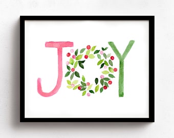 May include: A framed watercolor print of the word "JOY" with the "O" being a wreath of green leaves and pink berries.
