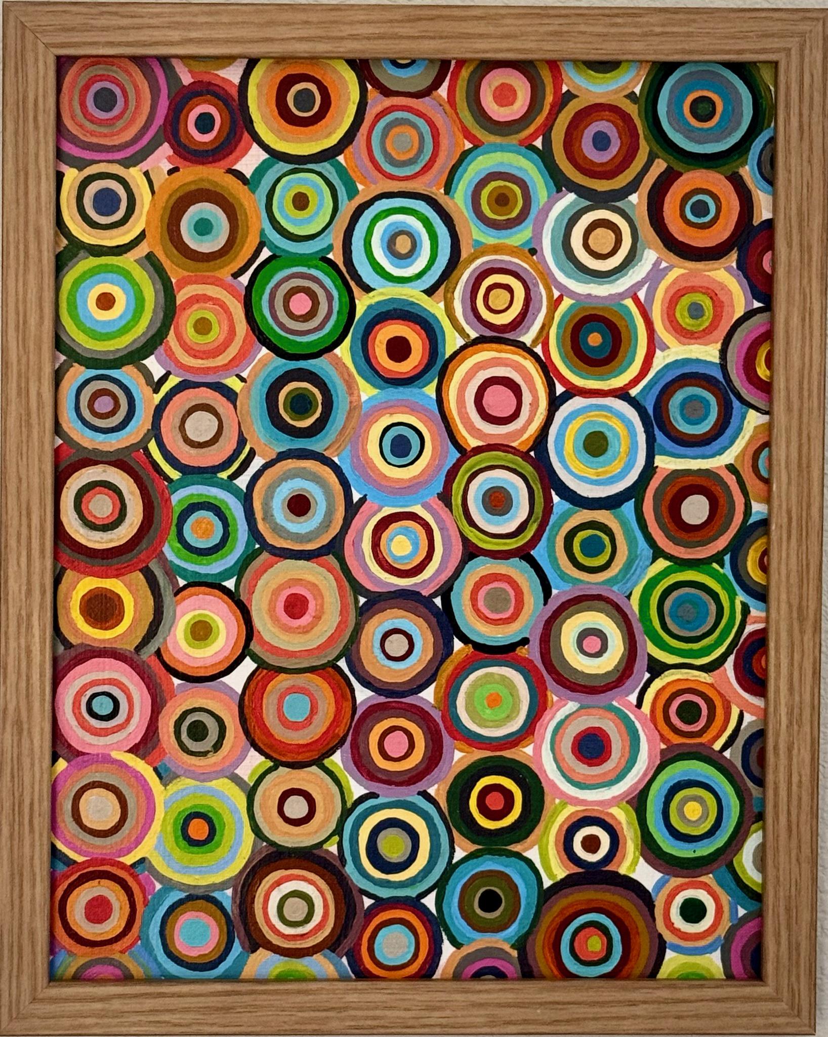 カラフルな幾何学模様の円を描いたキャンバスパネルのアクリル画