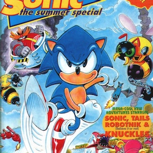 May include: A comic book cover featuring Sonic the Hedgehog, Tails, Robotnik, and Knuckles. The cover is blue, yellow, and red with the title "Sonic the Summer Special".