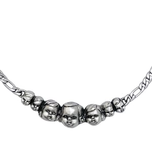 Baby Doll Heads Necklace.                             Silver gold parts oddity