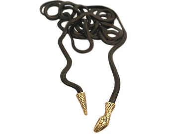 May include: A black snake chain necklace with gold snake head ends.