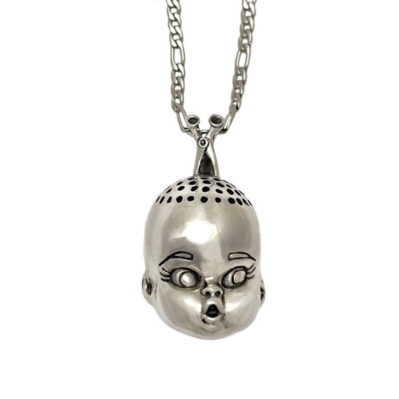 Baby head best sale necklace