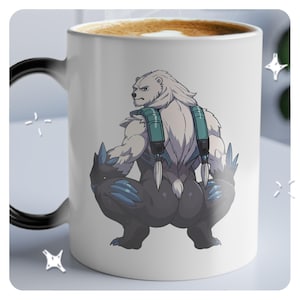 May include: White ceramic mug with a black handle. The mug features a cartoon illustration of a white bear with blue and black accents, sitting on its haunches.