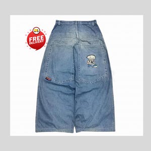 Retro Baggy Jeans,Y2K Denim Pants,Hip Hop Outfit,Wide Street Pants,Harajuku Denim,Gothic Baggy Fit,Cool Retro Look,Unisex Streetwear,Trendy Blue Jeans,Loose Denim Fit,Urban Baggy Jeans,Casual Y2K Style,Embroidered Pants