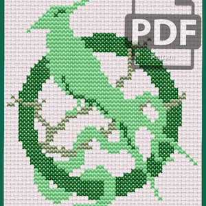 May include: Cross-stitch pattern featuring a green stylized bird within a circular frame, with a PDF icon in the upper right corner. The design is on a white background with a green border. The text "@dayslostinstitches" is at the bottom.