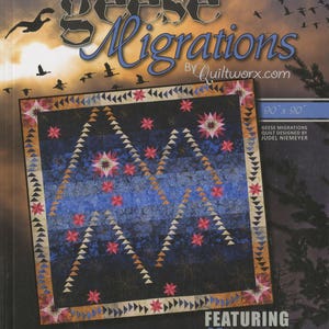 May include: A quilt pattern book titled "Geese Migrations" by Quiltworx.com. The cover features a quilt design with a blue background, pink stars, and brown triangles. The quilt is 90 inches by 90 inches and features 29 pattern designs by Quiltworx.com Certified Shops.