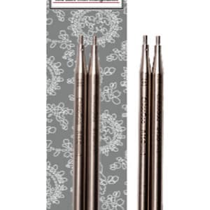 May include: A set of three silver Twist interchangeable knitting needles. The needles are labeled "Twist Red Lace Interchangeable".
