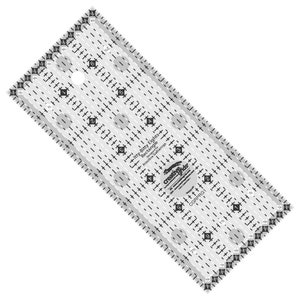 May include: A clear plastic quilting ruler with a grid pattern and circles. The ruler is labeled "Itty-Bitty Eights Rectangle" and "Creative Grids".