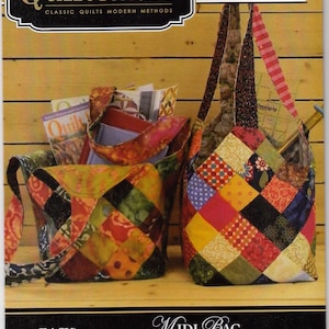 May include: Quiltsmart MIDI Bag pattern featuring two colorful patchwork bags. The bags are made with squares of fabric in various colors and patterns. The text on the pattern reads "EASY! FAST! SMART!" and "MIDI BAG: Simple technique, great bag! Squares on fusible interfacing sew up fast! Intersections match effortlessly!"
