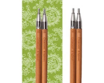 May include: A pair of bamboo interchangeable knitting needles with a green and white patterned background. The needles are labeled "ChiaoGoo 3.50 mm (US 4)".