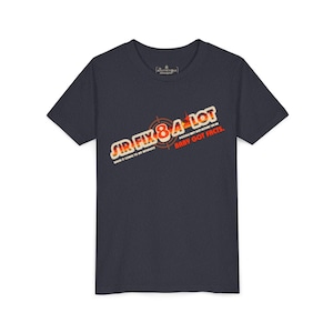May include: A dark blue t-shirt with a graphic print of a target with the text "SIR I FLY 8 4 A LOT GOOGLE AIN'T GOT NOBODY ON ME BABY GOT FACTS."