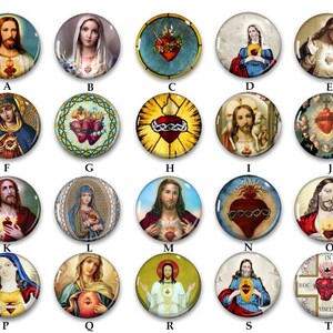 May include: A collection of 15 round, colorful, religious-themed buttons with images of Jesus, Mary, and the Sacred Heart. The buttons are arranged in a grid with letters A through T labeling each button.