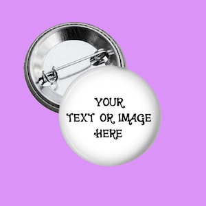 May include: A white button with a silver back. The button has black text that reads "YOUR TEXT OR IMAGE HERE".