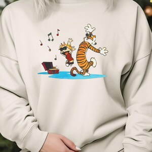 Calvin and Hobbes Dancing Shirt, Calvin Newspaper T-Shirt, Sweatshirt, Hoodie, Tote Bag - 251086