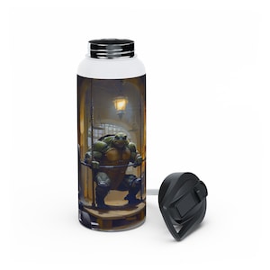 May include: A stainless steel water bottle with a black lid and a graphic of a Teenage Mutant Ninja Turtle in a cage. The bottle is white with a black and green image of the turtle.