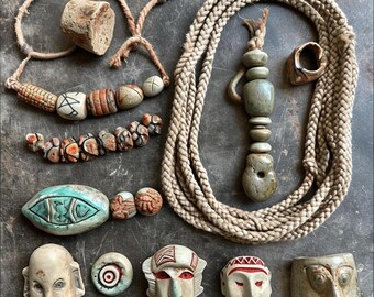 a knolling of Hopi handmade stoneware and braided rope necklace or bracelet