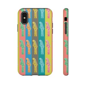 May include: A colourful phone case with a repeating pattern of guitar headstocks in various colours. The case is designed for an iPhone.