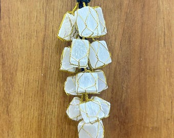 Hangend amulet selenietkristal: auto-, muur- en deurbescherming