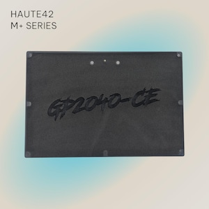 May include: Black rectangular speaker with the text "GP2040-CE" in white lettering. The speaker is part of the HAUTE42 M+ SERIES.