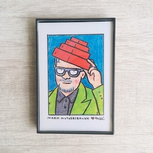 May include: A hand-drawn illustration of a person wearing a red brick hat and a green jacket. The person has a beard and glasses. The text "MARK MOTHERSBAUGH ♥ TODD!" is written below the image.