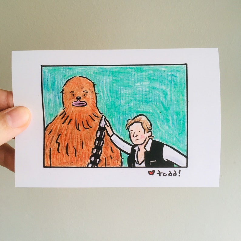 May include: A hand-drawn illustration of Chewbacca, a large, furry, brown Wookiee character from Star Wars, standing next to Han Solo, a human character from Star Wars. Han Solo is wearing a brown vest and a black shirt. The background is a teal green color. The image is signed "todd!" in the bottom right corner.