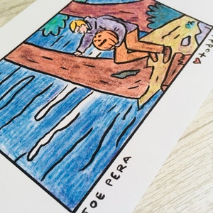 May include: A hand-drawn illustration of a person holding a pumpkin, sitting on a tree branch. The person is wearing a purple shirt and brown trousers. The background is a blue river with a brown tree trunk on the left side of the image. The text "TOE PERA" is written at the bottom of the image.
