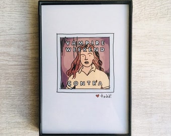 Może przedstawiać: Wydruk w ramie z ręcznie rysowaną ilustracją kobiety z czerwonymi włosami. Ilustracja znajduje się w ramce Polaroid z tekstem "Vampire Weekend" i "Contra". Tekst "todd!" jest napisany pod ramką.