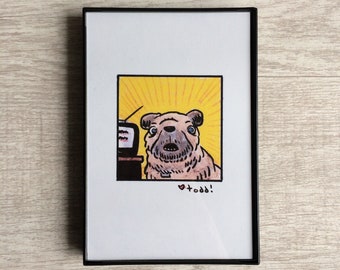 May include: A framed illustration of a dog with a surprised expression, looking at a television set. The dog is light brown with a black nose and black eyes. The background is yellow with a sunburst pattern. The text "todd!" is written below the dog.