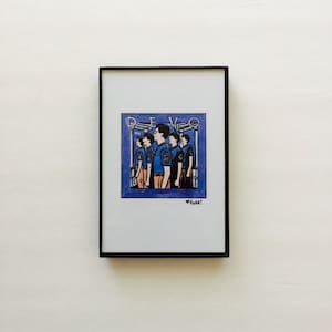 May include: A framed illustration of a band called DEVO. The band members are wearing blue shirts with a logo on the left side of their chests. The illustration is set against a blue background with a white border.