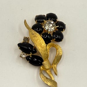 Vintage Gold-tone and black cabochons flower blossom brooch with center rhinestone