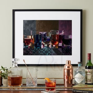 May include: A framed art print depicting a collection of colorful drinking glasses in shades of red, blue, and purple, arranged on a patterned surface. The artwork is displayed in a black frame with a white mat, showcasing a modern, geometric style.