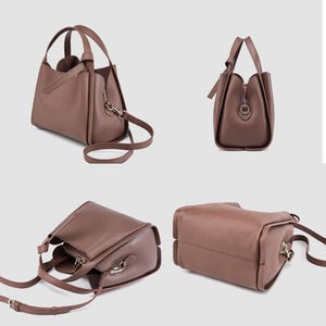 May include: A brown leather handbag with a top handle and a shoulder strap. The bag has a flap closure and a gold-toned buckle.